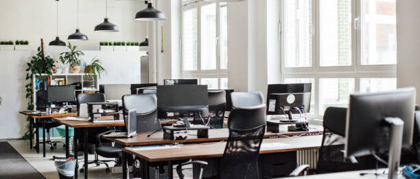 Interior of modern office with empty desk.